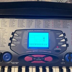 Casio Keyboard with Blue Display and Black Keys